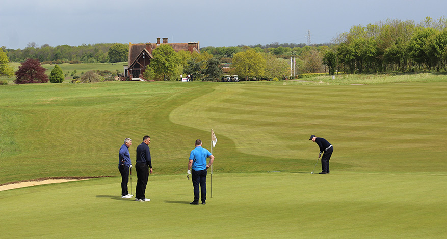 Four Men playing golf at Charity Golf Day