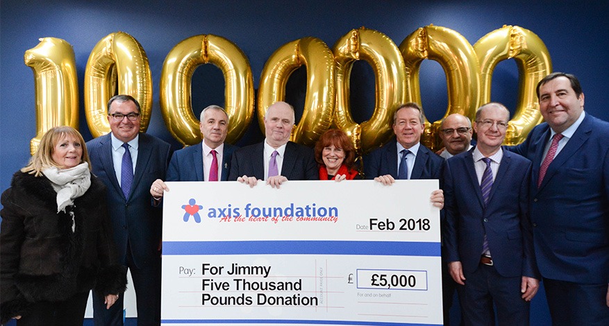 Axis patrons hold one million pound cheque.