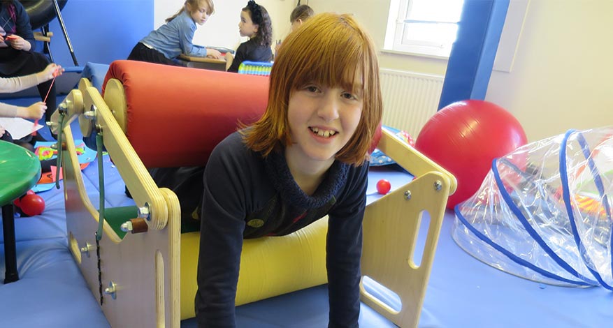 Children play with child theraeutic equipment donated to Blooming Blossoms.