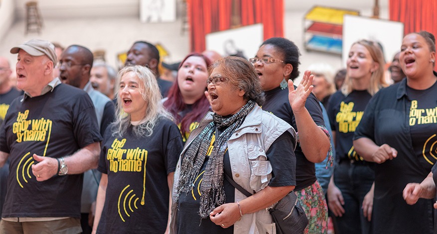 Members of the Choir With No Name sing together