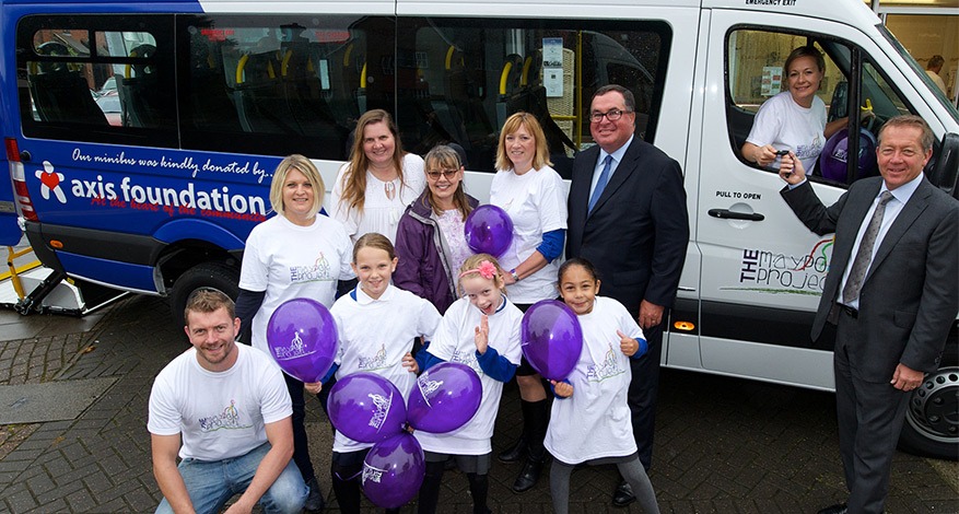 Axis CEO John Hayes handing over mini bus to Maypole charity