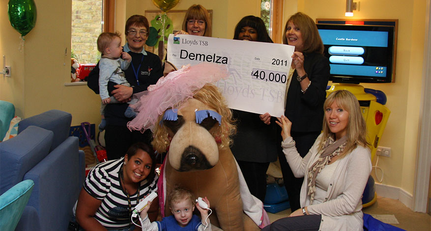 Axis Foundation trustee present £40,000 cheque to Demelza