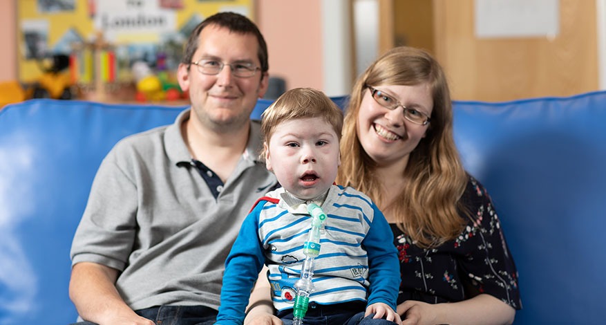 Child cared for at Demelza sat with parents.