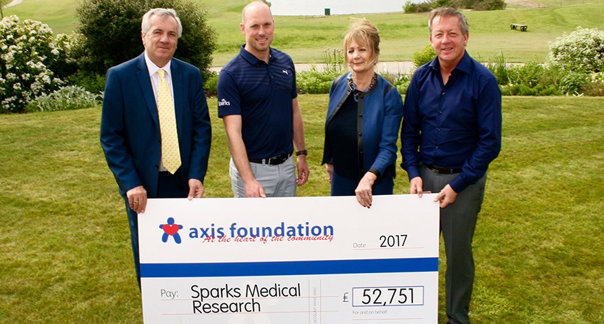 Axis Foundation Trustees giving a cheque to Sparks Medical Research Charity