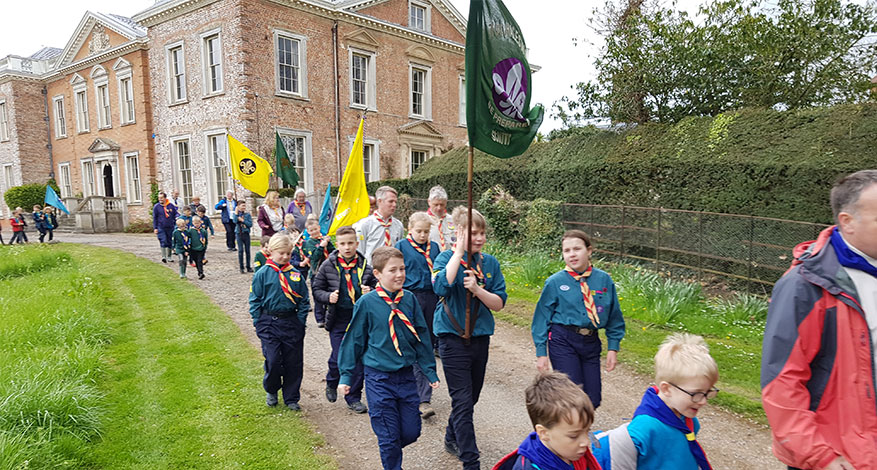 Children in Scout Group walking down a path