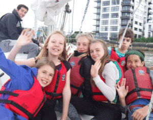 Young disadvantaged children sailing
