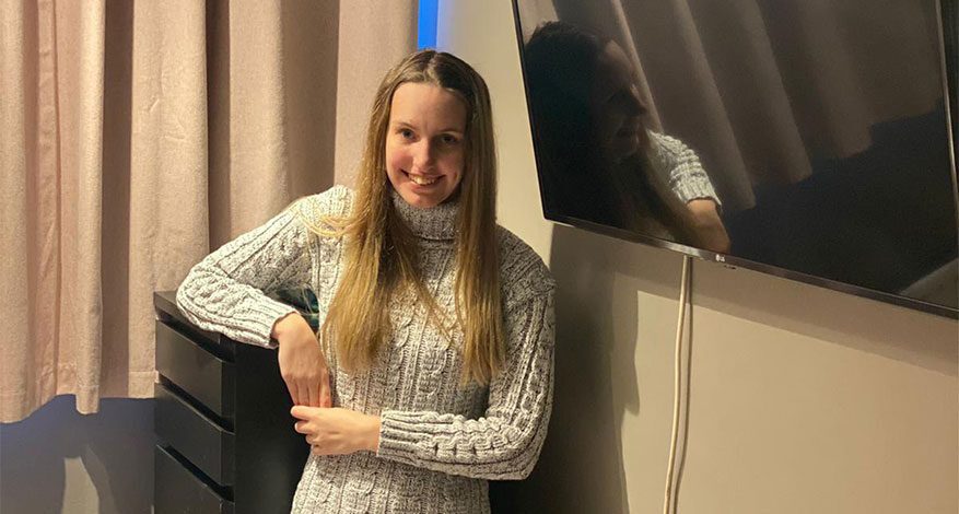 Girl standing in bedroom