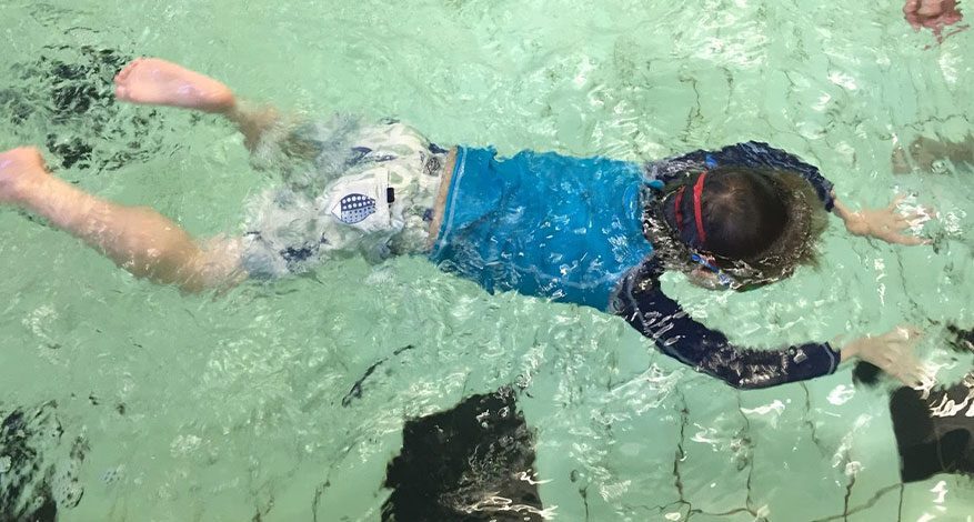 Young child having swimming lessons with Level Water