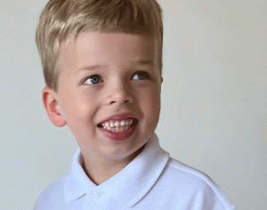 little boy with fair hair in white tee shirt