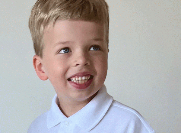 little boy with fair hair in white tee shirt