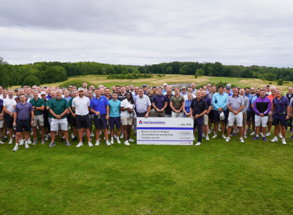 Long line of golf players and big cheque at centre