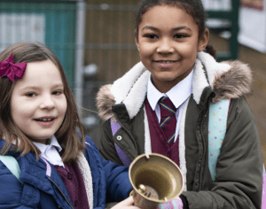 two children with school bell