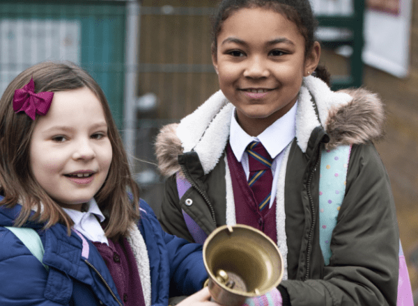 two children with school bell