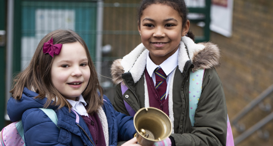 two children with school bell