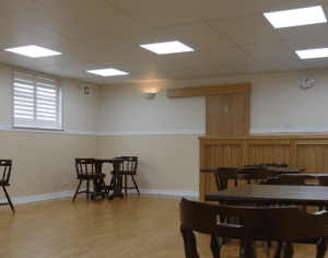hall with ceiling lights and tables and chairs