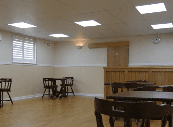 hall with ceiling lights and tables and chairs