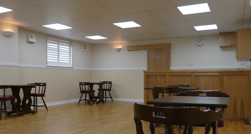 hall with ceiling lights and tables and chairs