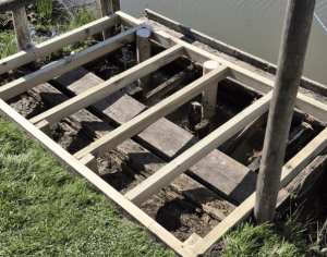 wooden platform by river