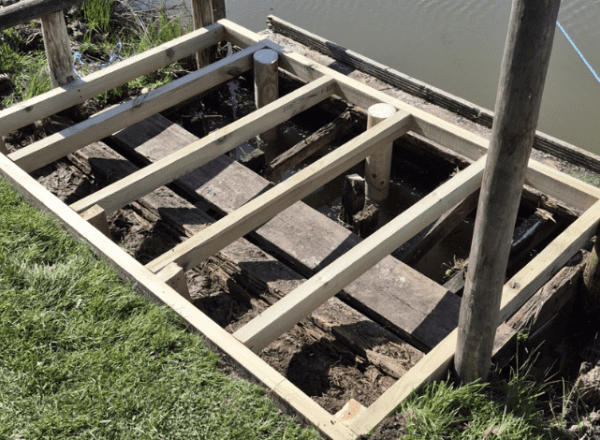 wooden platform by river