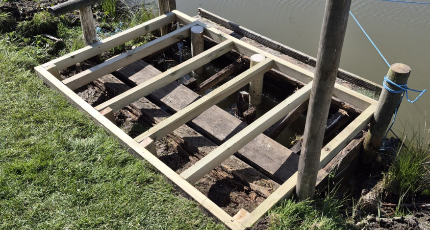 wooden platform by river